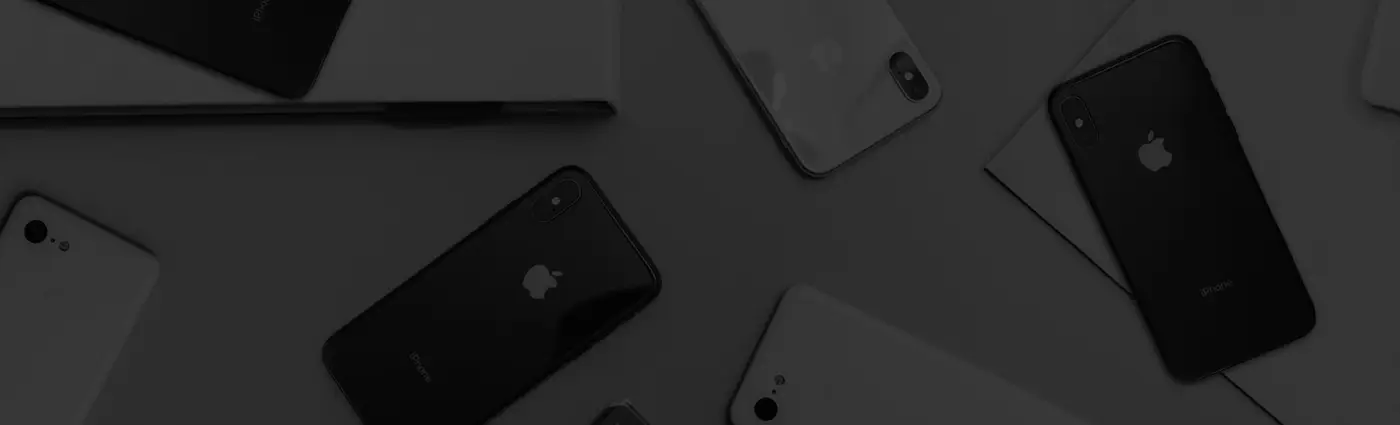 Graded pre-owned iPhones: side profiles, purple-sticker back and screen view